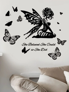 Detailed view of She Believed She Could wall decal with butterflies above a bed