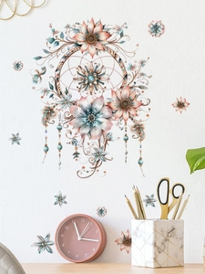Detailed view of bohemian floral dreamcatcher wall decals on a minimalist white room wall