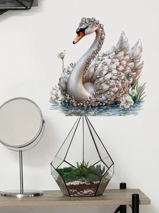 Detailed view of swan wall sticker with faux diamond inlay and floral accents on white wall