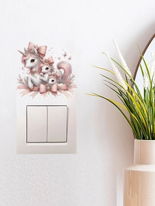 Nahaufnahme von rosa Einhorn-Wandtattoos, die einen weißen Lichtschalter im Zimmer zieren