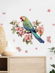Detail of colorful parrot on pink flower branch wall sticker in a cozy living room decor