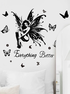 Detail of butterfly fairy wall decal with Everything Better text on bedroom wall