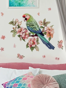 Detail of vibrant parrot and pink flowers wall sticker on a bedroom background wall