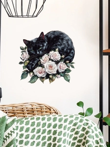 Artistic black cat and white roses wall sticker in a cozy living room setting