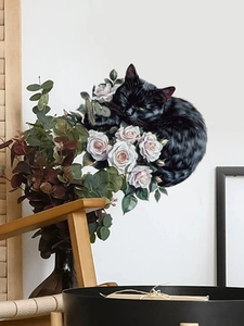 Detailed wall sticker featuring a black cat curled among white roses on a clean wall