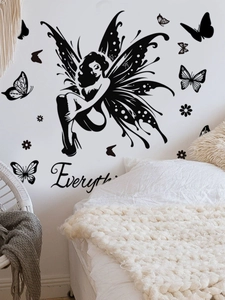 Bedroom wall detail featuring black butterfly girl fairy sticker and floral motifs