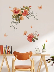 Vue détaillée des stickers muraux hibiscus orange avec feuilles vertes et papillons