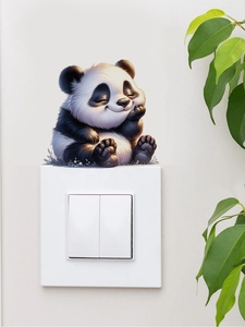 Close-up of 3D panda wall sticker sitting above light switch on minimalist white wall