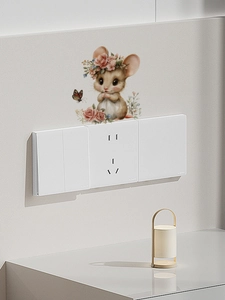 Detail of cute mouse wall sticker with flower crown and butterflies near light switch