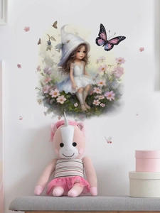 Detail of watercolor girl and pink flowers wall sticker on a white bedroom wall