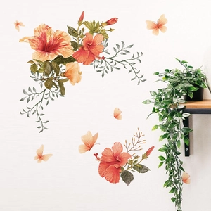 Stickers muraux fleurs d'hibiscus orange et papillons pour une décoration de salon chaleureuse