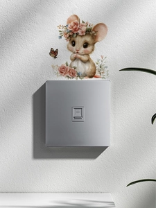 Close-up of cute watercolor mouse wall sticker with flower crown above a light switch