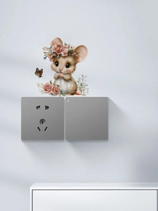 Detail of cute mouse wall sticker with pink roses and butterflies above a light switch