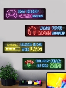 Neon gaming room wall decor featuring headset and controller with Eat Sleep Game Repeat text