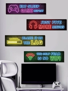 Neon gaming wall decals featuring game controller and headset designs for game room decor