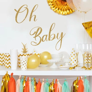 Golden Oh Baby wall decals with matching party supplies for stylish nursery celebrations