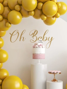 Detailed view of matte mustard yellow balloon arch kit for baby shower party decoration
