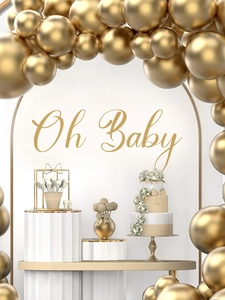 Detail of golden balloon arch with Oh Baby sign for party backdrop decoration