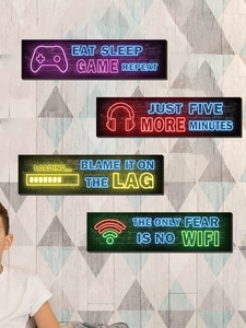 Detail showing four neon gaming wall art pieces with controller and headset icons