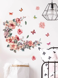 Detailed view of pink floral crescent moon and butterfly PVC wall decals in a bedroom setting