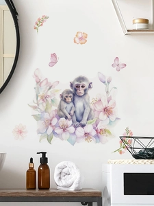 Vue détaillée des stickers muraux singes et fleurs aquarelle dans un décor de salle de bain