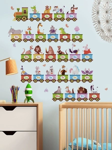 Detail view of colorful alphabet train wall stickers with cartoon animals for nursery decor