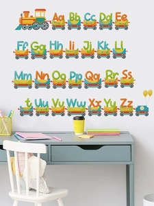 Detailed view of colorful 26-letter cartoon train wall stickers in a child bedroom