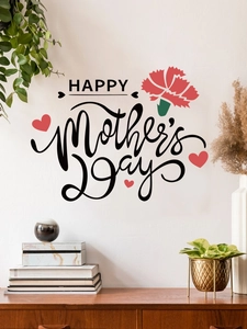 Detail showing Happy Mother's Day wall decal with carnation in a cozy living room decor