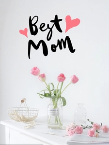 Detail of Best Mom wall sticker with pink hearts on a clean white living room wall