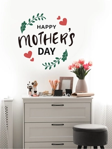 Detail of Happy Mother's Day wall sticker with green leaves and red hearts on white wall