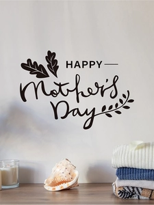 Gros plan du sticker mural Happy Mother's Day avec motifs de feuilles sur mur