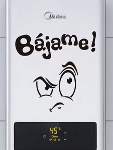 Close-up of funny cartoon face toilet sticker with Spanish text Bájame in black vinyl
