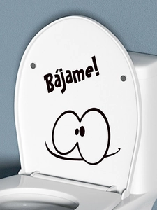 Close-up of funny cartoon eyes sticker with Bajame text on a white toilet lid
