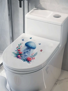 Detail of blue jellyfish and pink floral waterproof PVC stickers applied on a white toilet