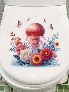 Dettaglio di un adesivo con medusa rossa e fiori sulla superficie di un copriwater bianco