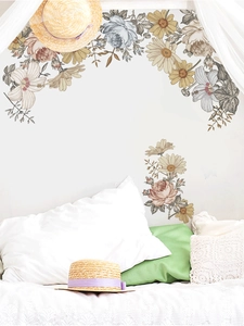Bedroom scene showing retro floral wall stickers with vintage flower and leaf patterns