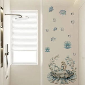 Blue mermaid and seashell PVC wall decal shown in a modern minimalist bathroom scene