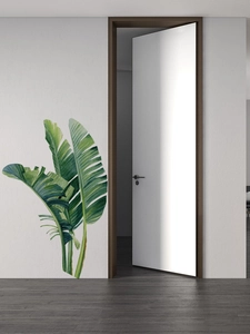 Stickers muraux détaillés de feuilles de palmier tropicaux sur un mur blanc moderne
