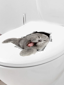 Detailansicht des 3D-Katzenaufklebers auf weißem Toilettendeckel mit Durchbrucheffekt