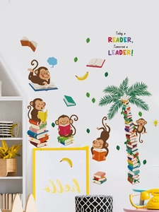 Detail of cartoon monkeys reading books wall decal with creative book palm tree on white wall