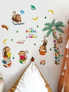 Detail of cartoon monkeys reading books with palm tree wall decal for kids bedroom decor