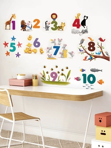 Detailed scene showing animal number wall stickers on a white wall in a cozy kid's room