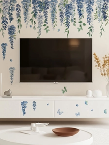 Detail of blue wisteria and butterfly wall decals on a living room TV background wall