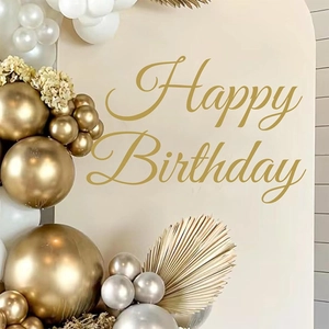 Golden and silver birthday party balloon set with dried palm leaves decorations