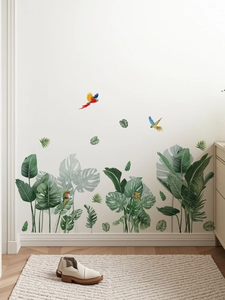 Vue détaillée des autocollants muraux feuilles de monstera et perroquets tropicaux sur mur