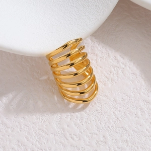 Detail of 18k gold plated multi-layer spiral cuff with premium mirror polished finish
