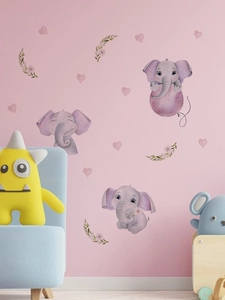 Detail of cute purple elephant wall decals with hearts and balloons in a nursery room