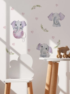 Detail of cute purple elephant wall stickers in a cozy nursery room setting