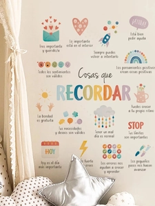Detailed view of Spanish inspirational wall stickers with rainbow and rocket designs