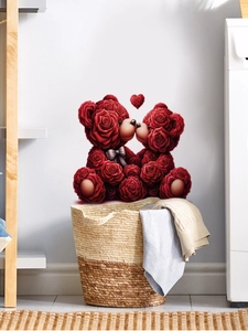 Close-up of red rose heart and kissing bears wall decal on a clean white bathroom wall